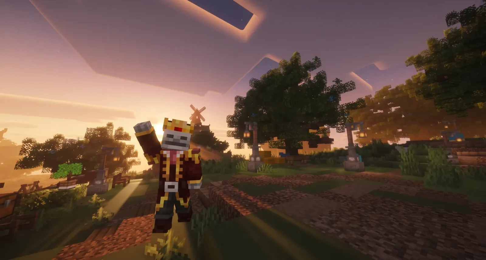 Menrael fait un signe de la main au coucher du soleil